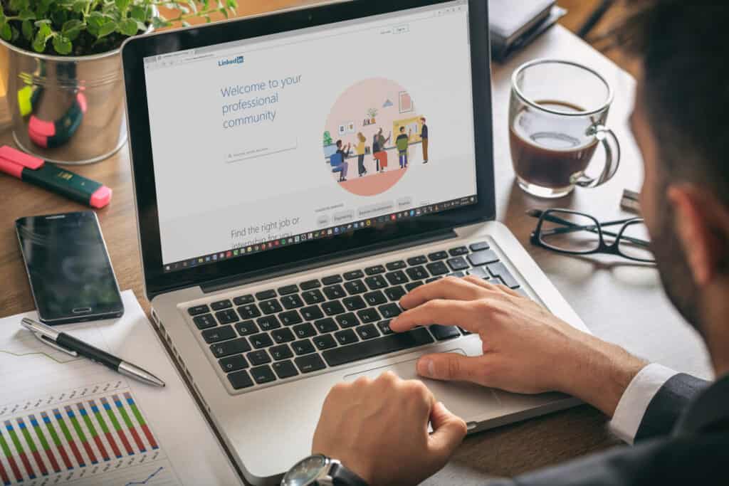 Picture of someone looking at LinkedIn on a computer