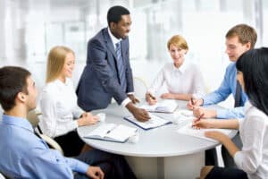 A diverse group of people working at top consulting firms