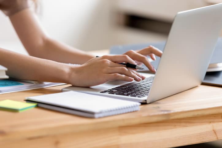 person typing on computer