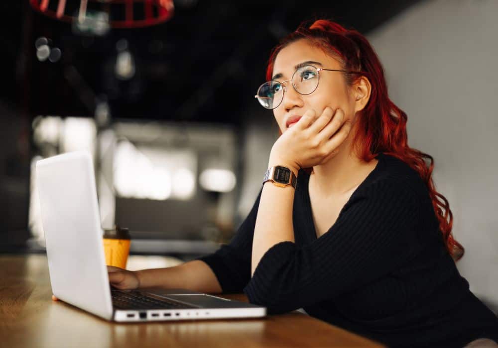 person sitting at laptop considering how to choose a career