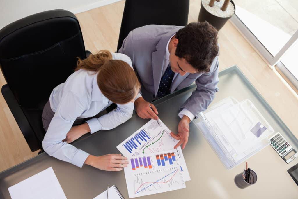 Management consultant analyzing data with client