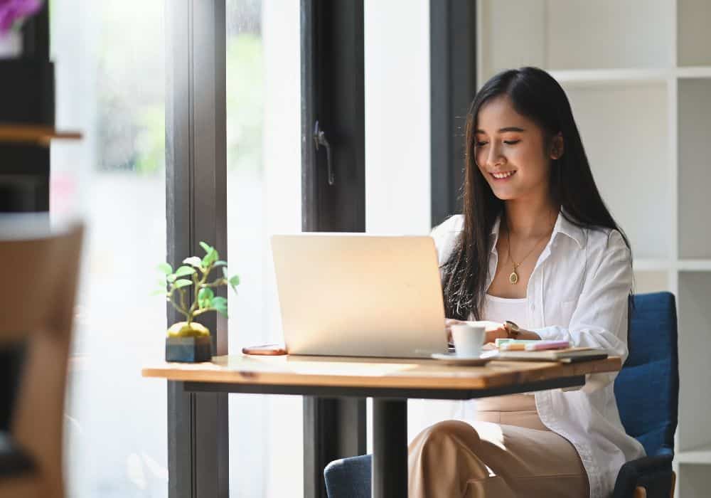 student sitting looking at laptop