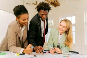 three employees communicating at work