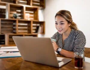 recruiter looking at computer and smiling